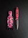 "Sirko: Hunting Knife for Real Pros" (etching, pink handle, colored scabbard)