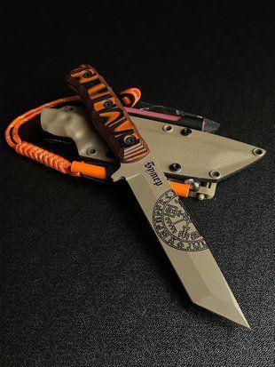 Tanto &ndash; a hunting knife for masters of precision and endurance in nature (tan polymer, black-orange handle, tan scabbard)