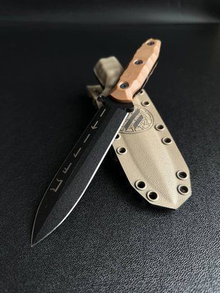 "Vakulich" &ndash; A knife that conquers the elements of nature (black polymer, orange handle, colored scabbard)