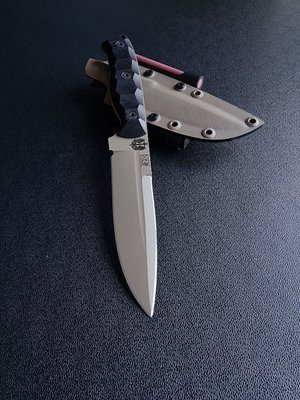 Shchedrik polymer tan - a widely versatile tactical knife with a double-edged blade (Black handle, colored scabbard)